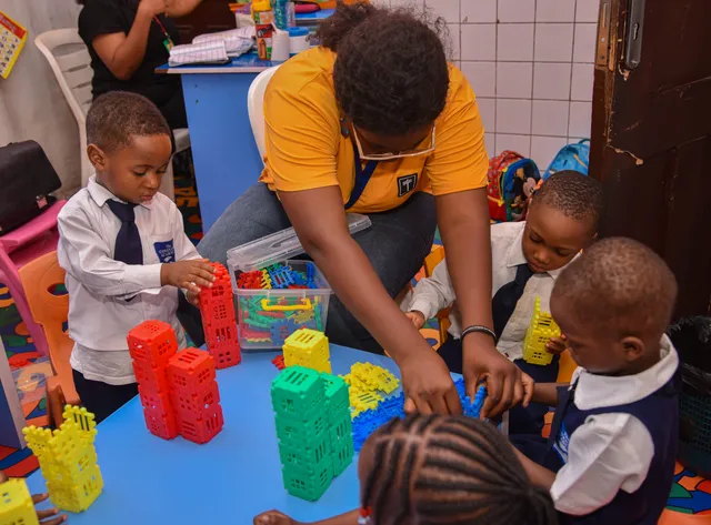 Children enjoying robotics activities during recess time