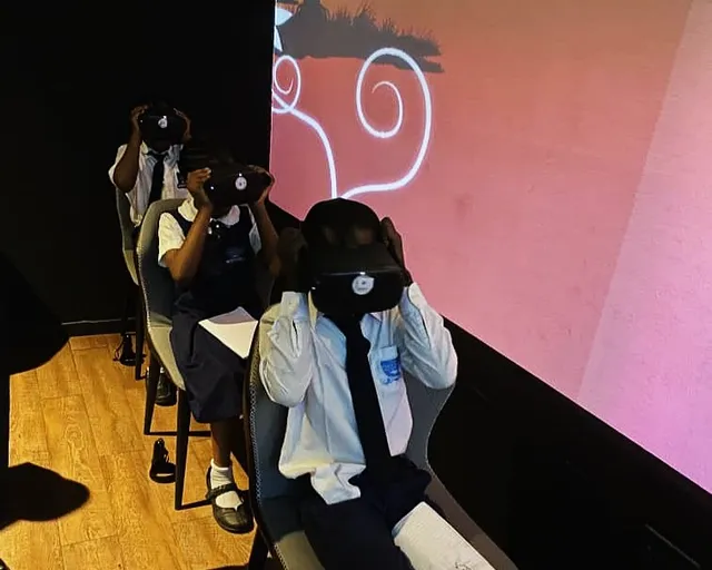 Students using virtual reality technology at arts and technology museum